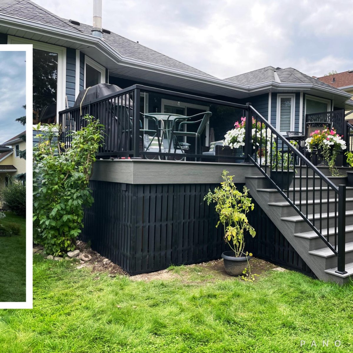 A dark composite deck with glass railing and a decorative privacy screen